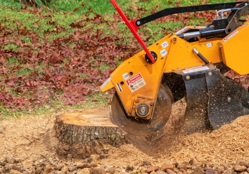 A machine performing stump grinding